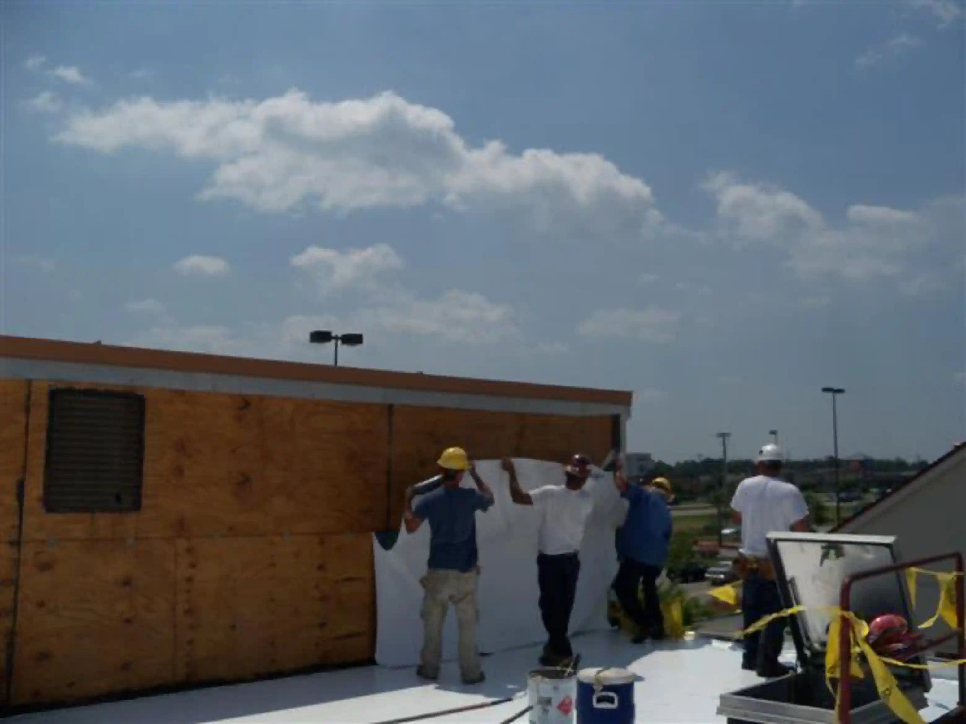 The after of a commercial roof replacement project, of a new TPO roof.