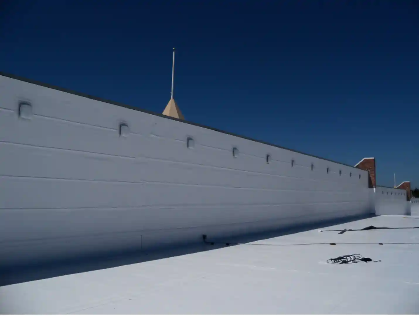 Project completed of a commercial roof replacement with a new TPO roof.